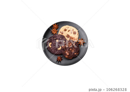 Delicious fresh crispy oatmeal cookies with chocolate and nuts 106268328