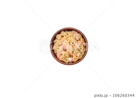 Delicious farfalle pasta with langoustine shrimp with creamy sauce 106268344