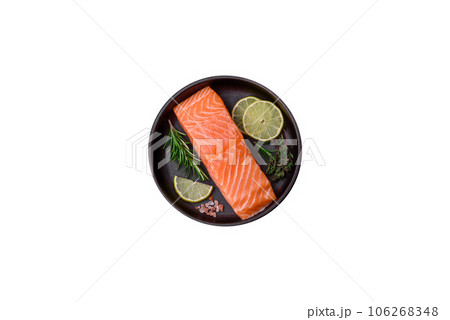 Fresh tasty raw red fish fillet with spices and herbs Fresh tasty raw red fish fillet with spices and herbs 106268348