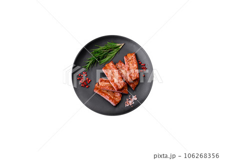 Grilled fresh juicy ribs with salt, spices and herbs 106268356