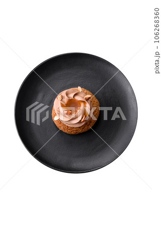 Delicious sweet shu cake with cream and nuts 106268360