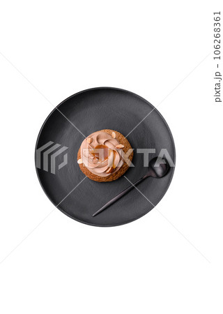 Delicious sweet shu cake with cream and nuts 106268361