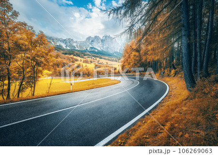 Road in mountains at sunny day in golden autumn. Dolomites, Italy 106269063