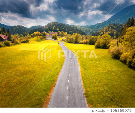 Aerial view of road in alpine meadows at sunset in autumn 106269079