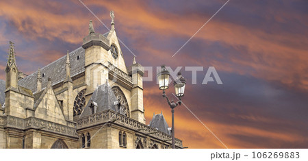 Great gothic church of Saint Germain l Auxerrois (against the background of a sky at sunset), Paris, France 106269883
