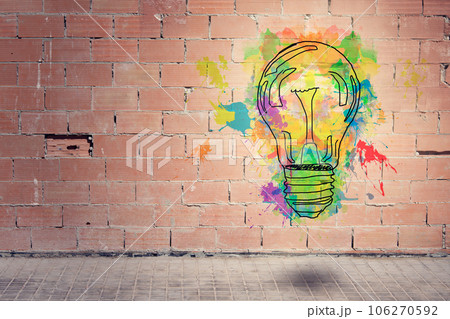 light bulb on brick wall 106270592