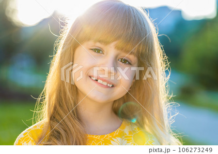 Portrait of happy preteen child girl face smiling looking at camera good mood, satisfied on park Portrait of happy preteen child girl face smiling looking at camera good mood, satisfied on park 106273249