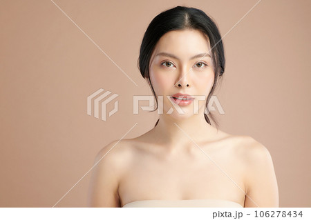 Beautiful young asian woman with clean fresh skin on beige background, Face care, Facial treatment, Cosmetology, beauty and spa, Asian women portrait. 106278434