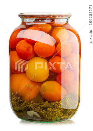 Tomatoes in the glass jar isolated in white background. Homemade pickles. 106282575