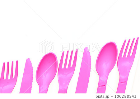 Pink plastic spoons, forks, knives for camping, isolated on white 106288543