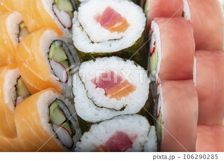 Sushi rolls with salmon and tuna , close up shot Sushi rolls with salmon and tuna , close up shot 106290285