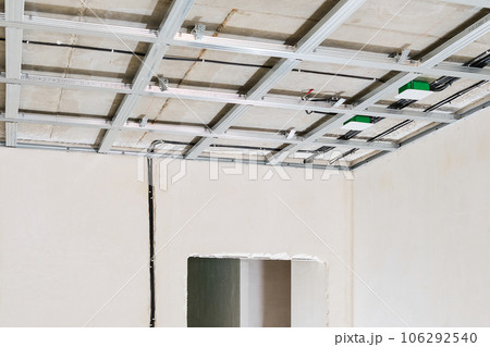 Frame for the installation of drywall by builders at the construction site. A simple and cheap way to make a partition or ceiling for renovation or renovation Frame for the installation of drywall by builders at the construction site. A simple and cheap way to make a partition or ceiling for renovation or renovation 106292540