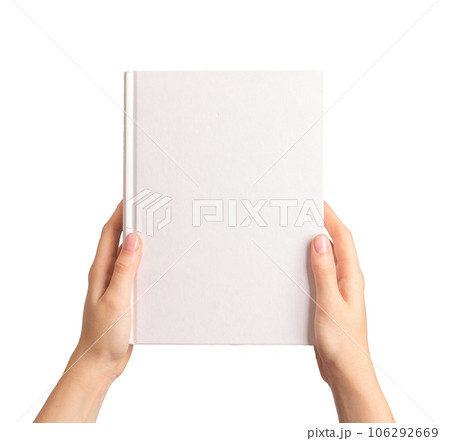 Hands holding closed book cover mock up, blank hardcover mockup isolated on white background Hands holding closed book cover mock up, blank hardcover mockup isolated on white background 106292669