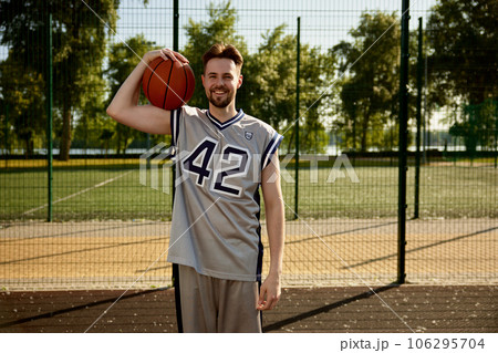 Headshot portrait of smiling happy basketball player Headshot portrait of smiling happy basketball player 106295704