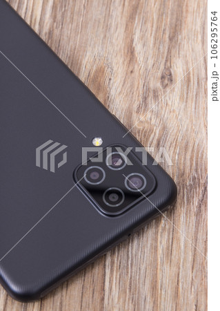 Closeup of camera lens in smartphone. Modern technology using in phones 106295764