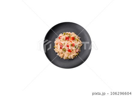 Delicious boiled rice with vegetables peppers, carrots, peas and asparagus beans Delicious boiled rice with vegetables peppers, carrots, peas and asparagus beans 106296604