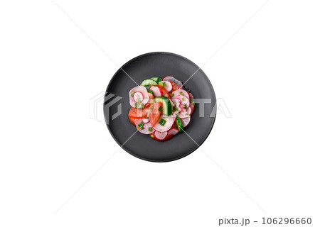 Delicious vegan salad of fresh vegetables of tomatoes, cucumbers and radishes Delicious vegan salad of fresh vegetables of tomatoes, cucumbers and radishes 106296660