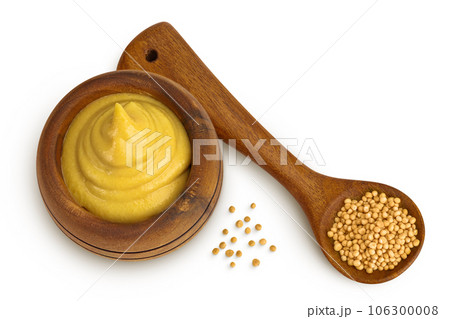 Mustard sauce in wooden bowl with seed isolated on white background. Top view. Flat lay 106300008
