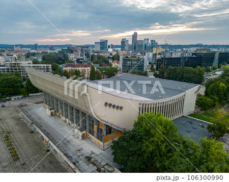 Aerial view of the Soviet Abandoned Palace of Concerts and Sports and modern city center in Vilnius Aerial view of the Soviet Abandoned Palace of Concerts and Sports and modern city center in Vilnius 106300990
