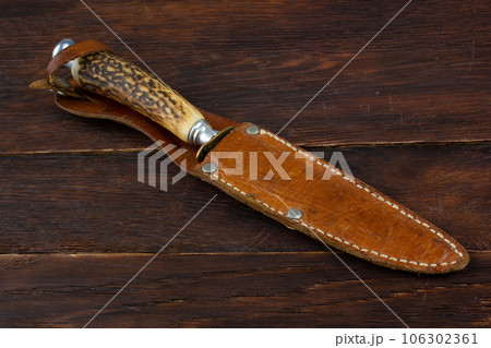 Vintage hunting knife with leather holster Vintage hunting knife with leather holster 106302361