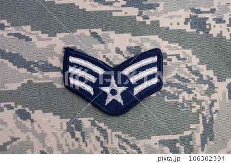 August 31, 2020. US AIR FORCE Senior Airman rank patch on digital tiger-stripe pattern Airman Battle Uniform 106302394