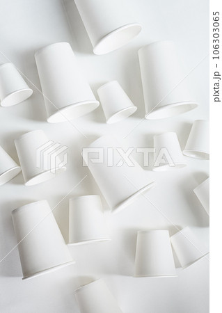 Paper coffee cups different sizes layout, monochrome image. Paper coffee cups different sizes layout, monochrome image. 106303065