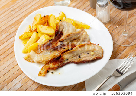 Fried pork with potatoes Fried pork with potatoes 106303694