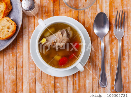 Light vegetable soup with slices of pork 106303721