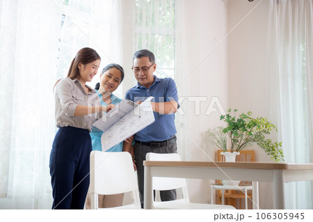 Happy couple elderly looking new home while agent real estate explaining and visit. 106305945
