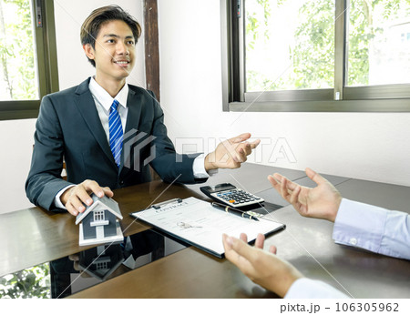 Real estate agent explain the business contract, rent, buy, mortgage, loan, or home insurance Real estate agent explain the business contract, rent, buy, mortgage, loan, or home insurance 106305962
