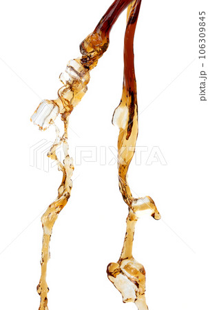 Coffee drink water mix ice cube fall pouring down in Shape form line of espresso black coffee splashes into drop soda cola attack fluttering in air, stop motion freeze shot. Splash coffee cola drink Coffee drink water mix ice cube fall pouring down in Shape form line of espresso black coffee splashes into drop soda cola attack fluttering in air, stop motion freeze shot. Splash coffee cola drink 106309845