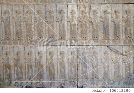 Ancient wall with bas-relief with assyrian warriors with spears, Persepolis, Iran. UNESCO world heritage site 106312190