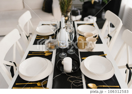 Black and white serving of the festive dining table Black and white serving of the festive dining table 106312583