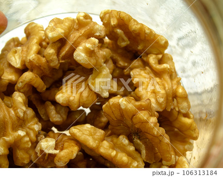A small glass bottle of shelled walnuts. A small glass bottle of shelled walnuts. 106313184