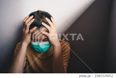 Sadness or depressed woman crying after failure and layoff from work because impact from covid-19 pandemic outbreak. Sadness or depressed woman crying after failure and layoff from work because impact from covid-19 pandemic outbreak. 106314852