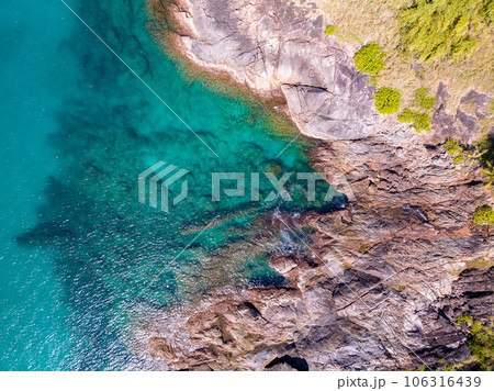 Aerial view seashore with mountains at Phuket Thailand, Beautiful seacoast view at open sea in summer season, Nature recovered Environment and Travel background Aerial view seashore with mountains at Phuket Thailand, Beautiful seacoast view at open sea in summer season, Nature recovered Environment and Travel background 106316439