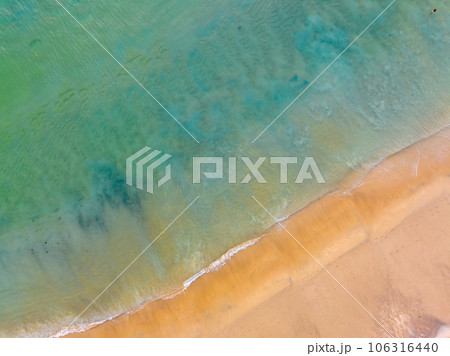 Summer sea nature background,Aerial view of Waves crashing on sandy shore,Sea surface ocean waves background Summer sea nature background,Aerial view of Waves crashing on sandy shore,Sea surface ocean waves background 106316440