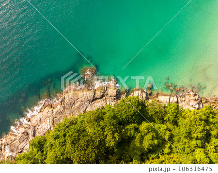 Aerial view seashore with mountains at Phuket Thailand, Beautiful seacoast view at open sea in summer season, Nature recovered Environment and Travel background Aerial view seashore with mountains at Phuket Thailand, Beautiful seacoast view at open sea in summer season, Nature recovered Environment and Travel background 106316475