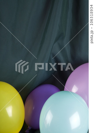balloons in harmonious colors on a wavy green background balloons in harmonious colors on a wavy green background 106318934