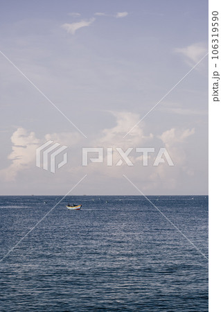 Blue Sea sky cumulus cloud landscape view background. Calm water alone fishing boat. Destination aim progress concept 106319590