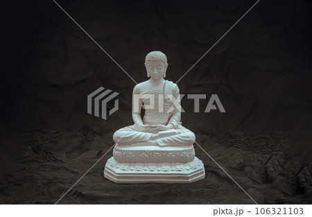 White figurine of siddhartha gautama buddha sculpture statue with dark background. White figurine of siddhartha gautama buddha sculpture statue with dark background. 106321103