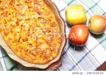 apple pie in a baking dish. fresh apples apple pie in a baking dish. fresh apples 106322616