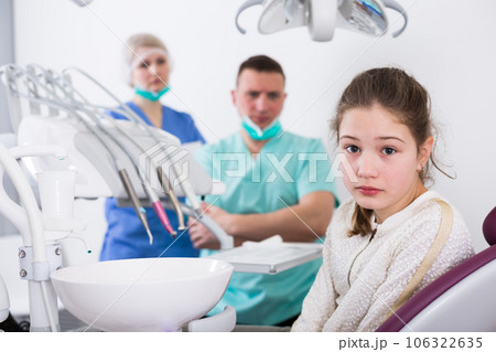 Upset girl in dental chair Upset girl in dental chair 106322635
