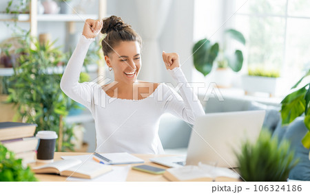 woman working on laptop at home. woman working on laptop at home. 106324186