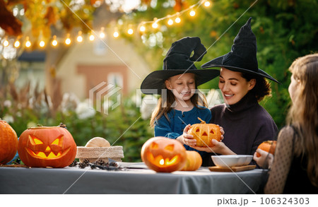 family preparing for Halloween 106324303