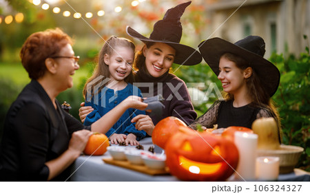 family preparing for Halloween 106324327