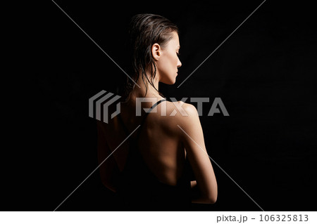 Beautiful sexy model Girl in black Dress. Female Back 106325813