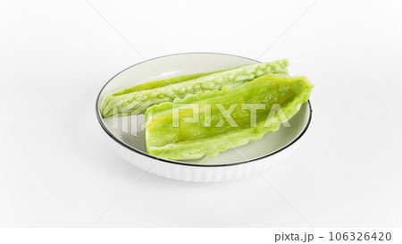 Bitter gourd on a white background board. Bitter gourd on a white background board. 106326420