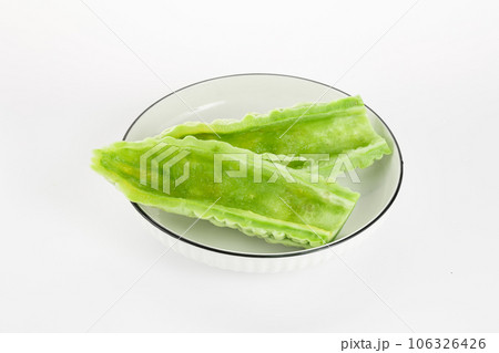 Bitter gourd on a white background board. Bitter gourd on a white background board. 106326426