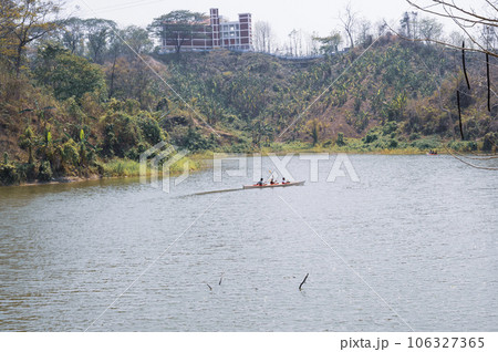 People rowing a boat on the river at Bandarban, Bangladesh People rowing a boat on the river at Bandarban, Bangladesh 106327365